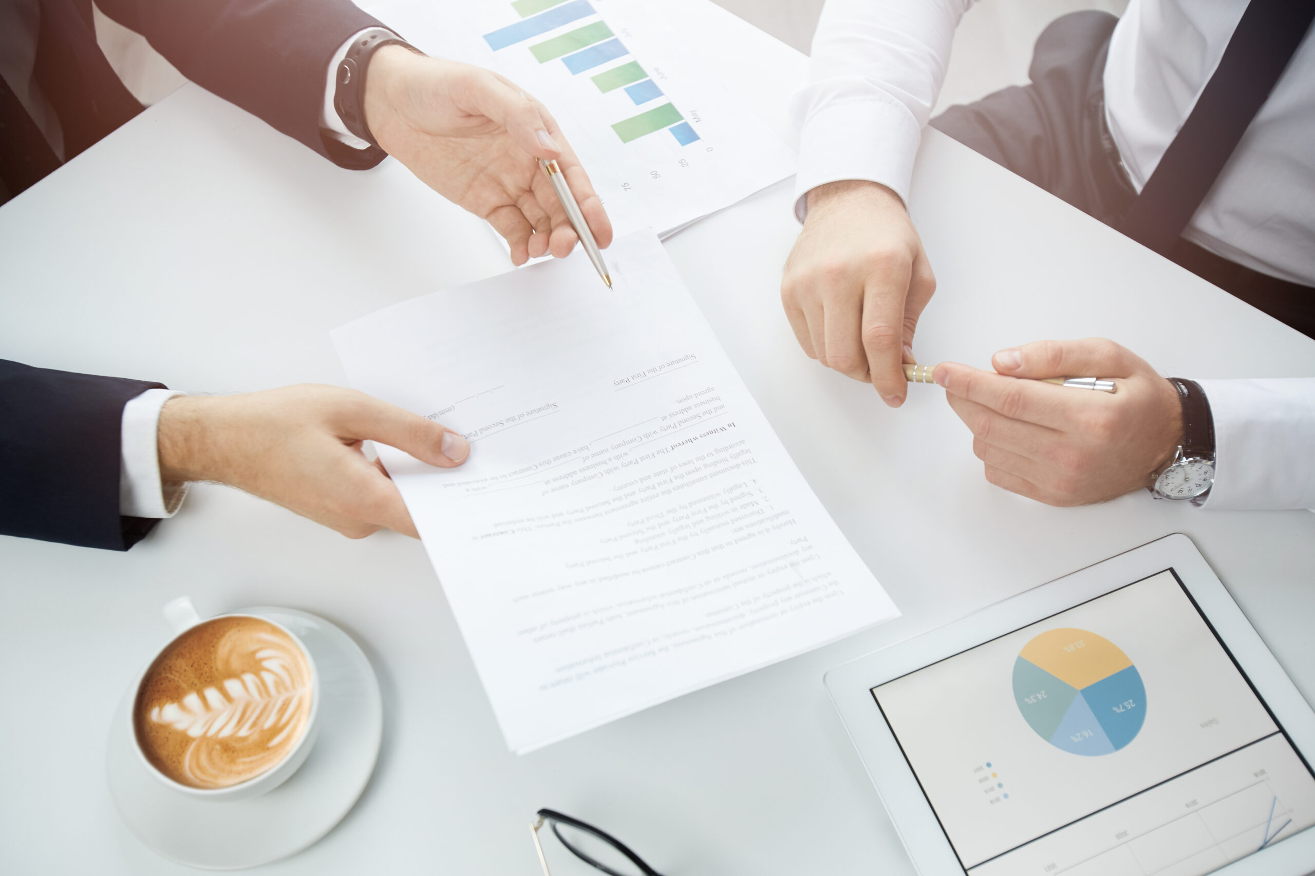 Offering to sign contract to customer Close-up of unrecognizable manager holding paper and giving pen to customer while offering him to sign contract